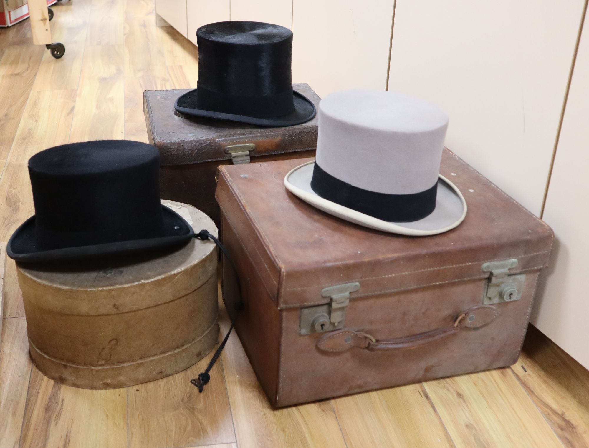Two Victorian Locke & Co silk top hats and two felt top hats